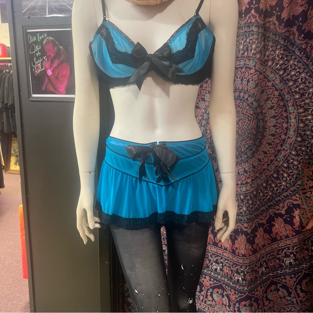Trashy lingerie blue and black set with garters size large. Perfect condition!